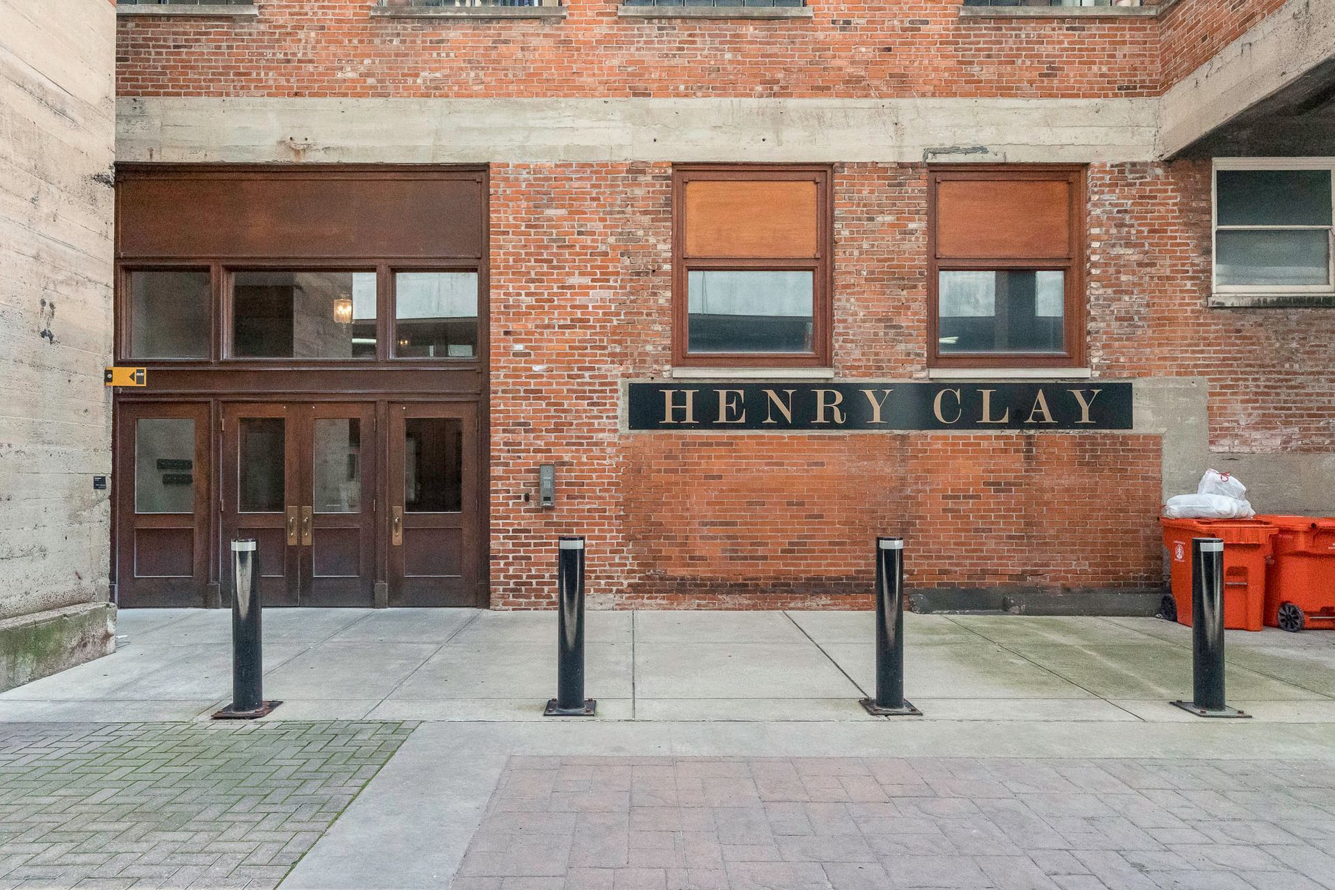 A brick building with a sign that says henry clay