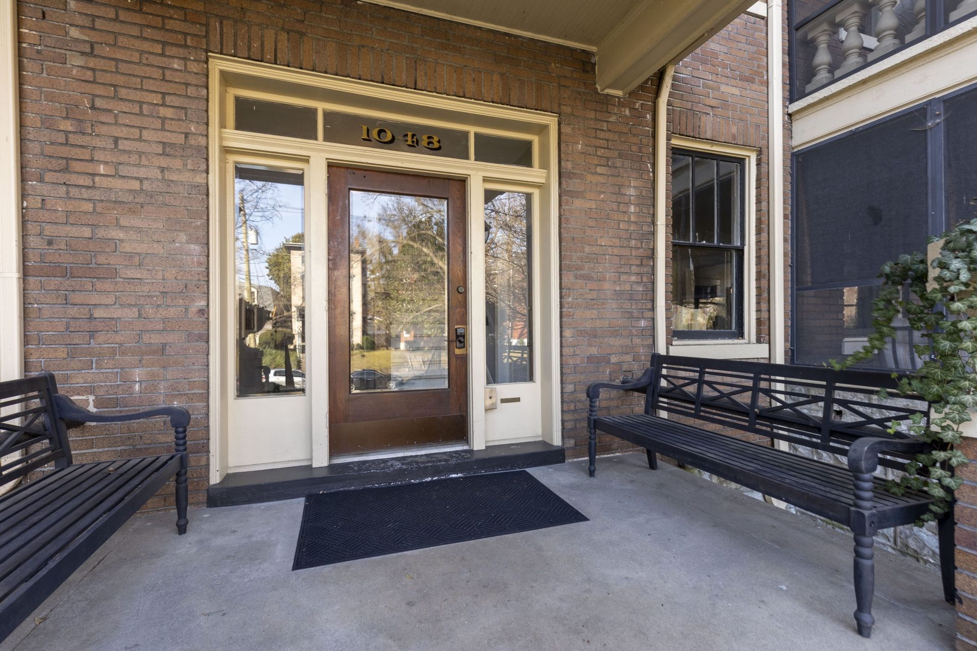 a brick building with a bench in front of it