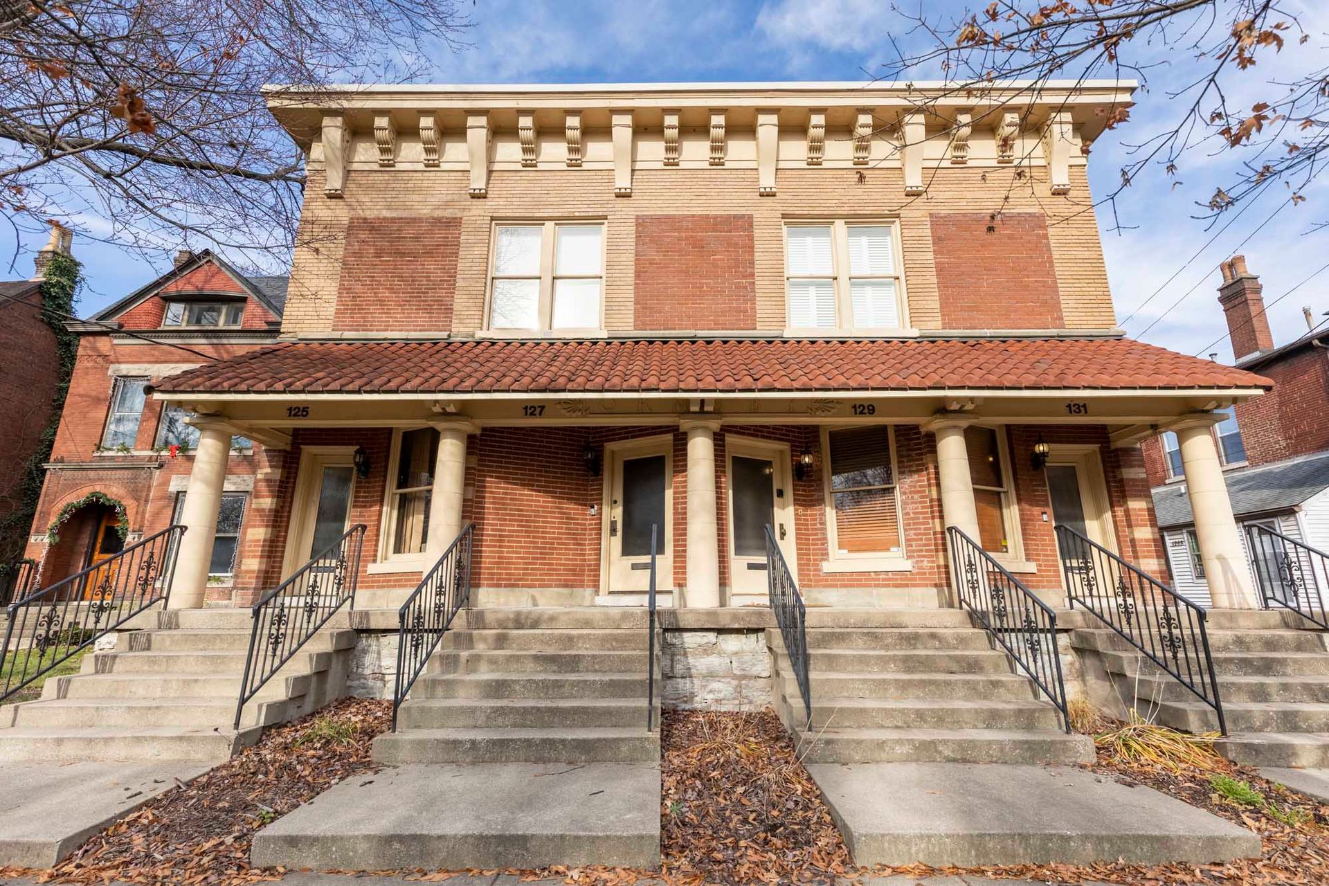 a large brick building with stairs leading up to it