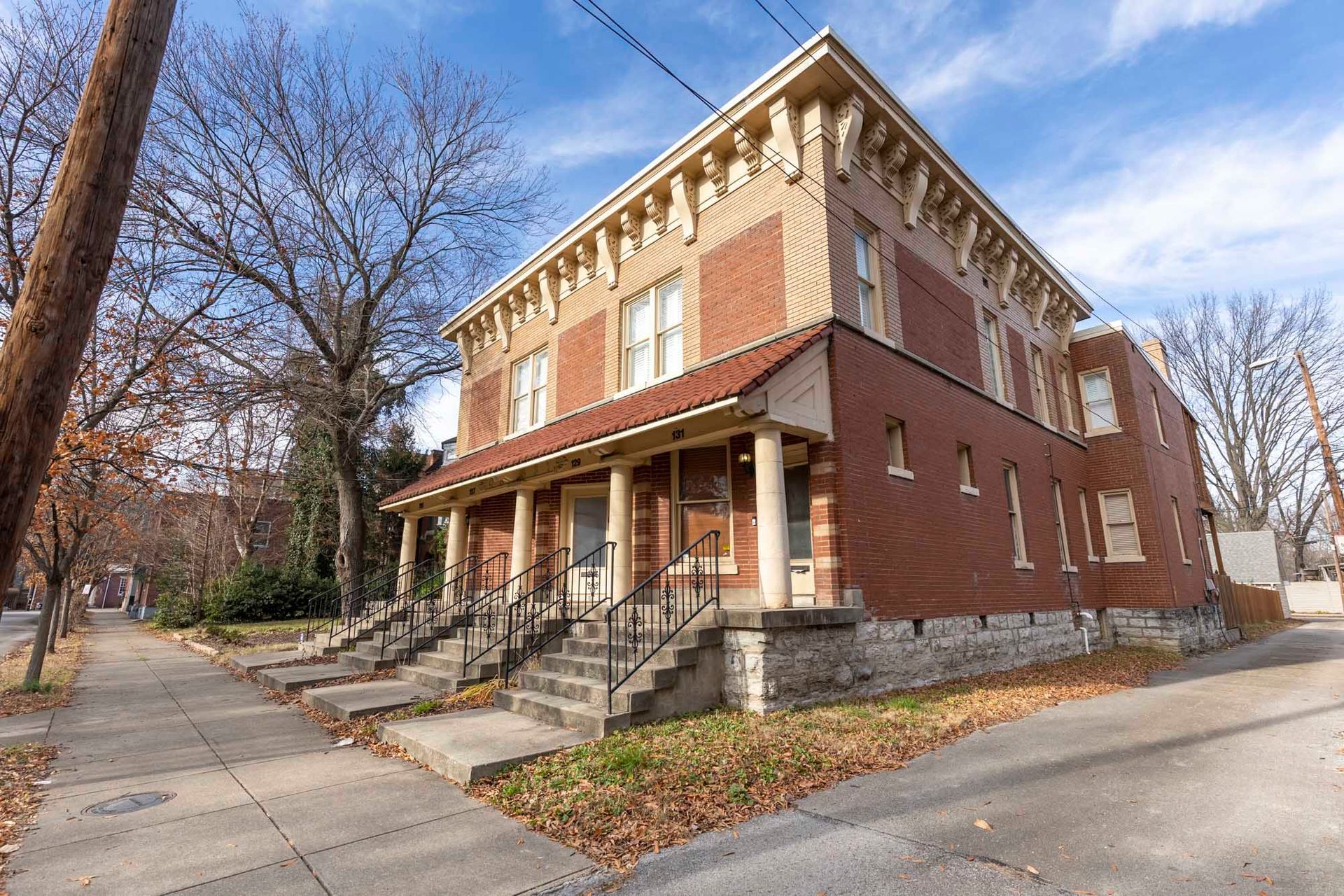 a large brick building with stairs leading up to it