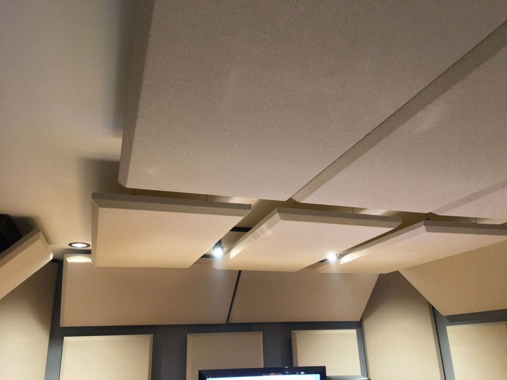 Metal grid ceiling with recessed lighting.