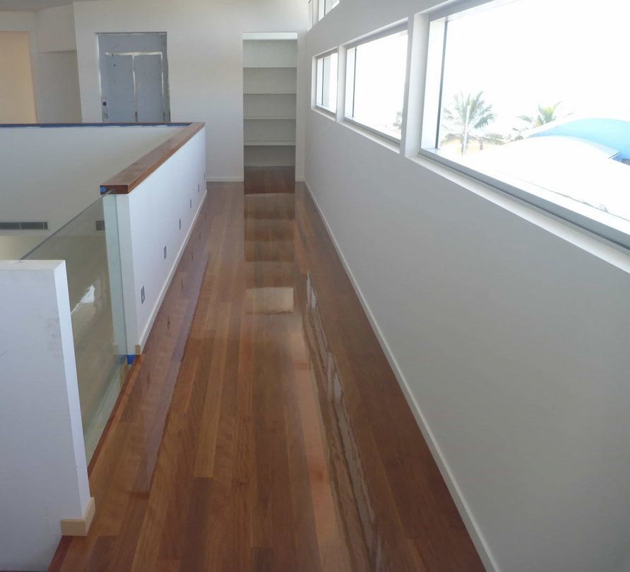 Dark brown timber flooring — Flooring In Sharon, QLD