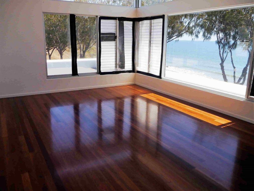 Floor sanding and opened window — Flooring In Sharon, QLD