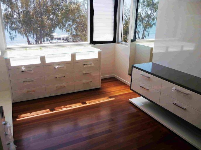Timber flooring and white cabinets — Flooring In Sharon, QLD