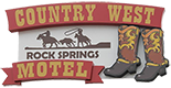 A sign for the Country West Rock Springs Motel featuring a cowboy on horseback, roping, and a pair of western boots.