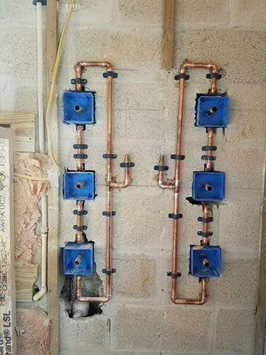 Pipe setup in bathroom — plumbing services in Port Charlotte, FL