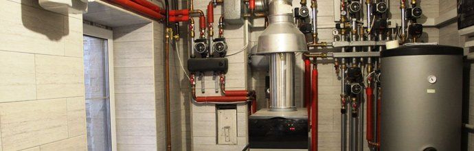 Water Heater with Red Pipe — Boca Grande, FL — Five Star Plumbing Of SW Florida