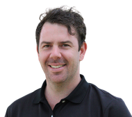 A man in a black shirt is smiling for the camera