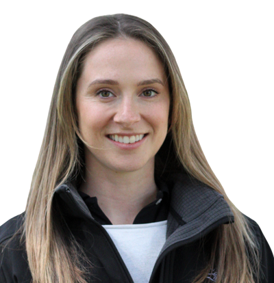 A woman wearing a black jacket is smiling for the camera