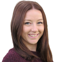 A woman with long brown hair is smiling and wearing a maroon sweater