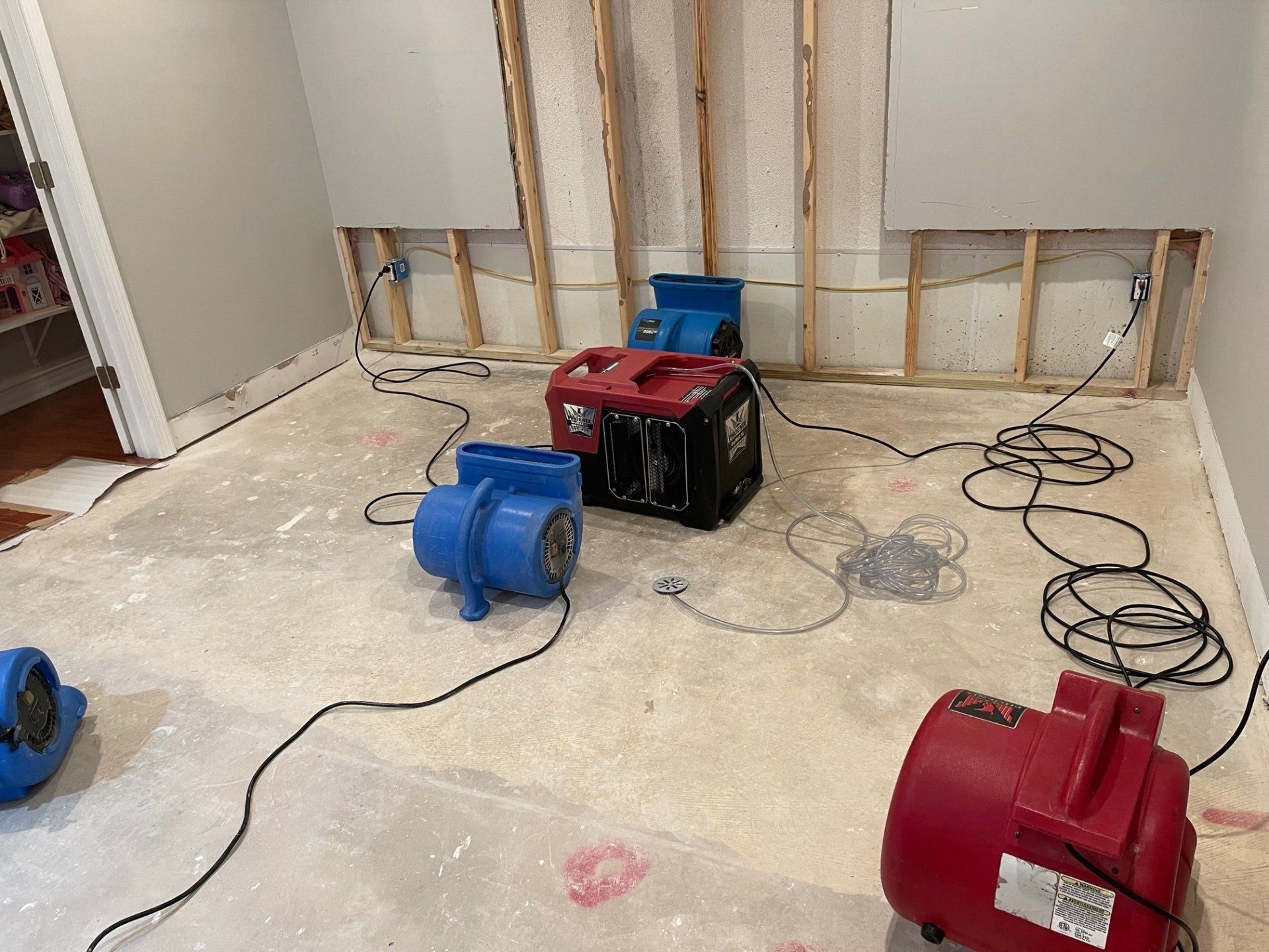 A room with a lot of electrical equipment on the floor.