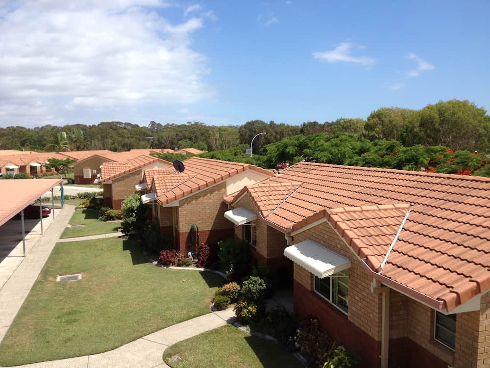 An Aerial View of a Row of Houses With Tiled Roofs — Killiby & Co Roofing Pty Ltd In Tweed, NSW
