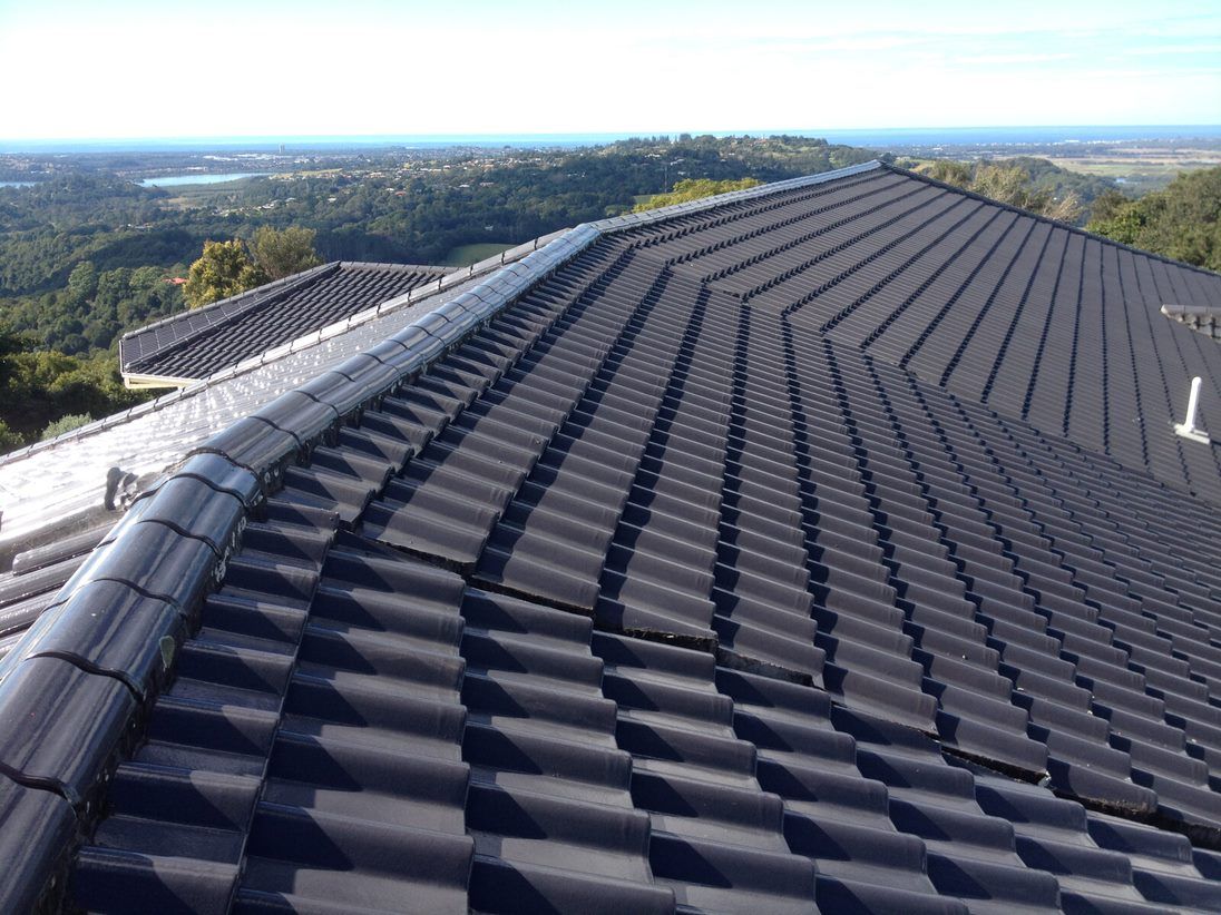 Black Roof Tiles — Roof & Gutter Repairs in Tweed Heads, NSW