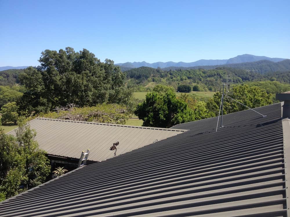 A Roof With a View of Trees and Mountains in the Background — Killiby & Co Roofing Pty Ltd In Tweed, NSW
