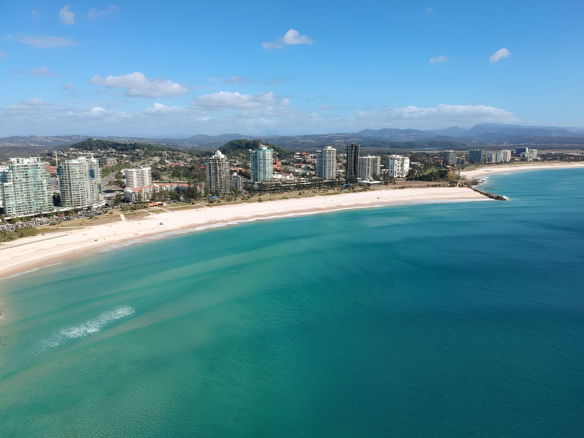 Oceanfront Beach and City Skyline — Killiby & Co Roofing Pty Ltd in Coolangatta, NSW