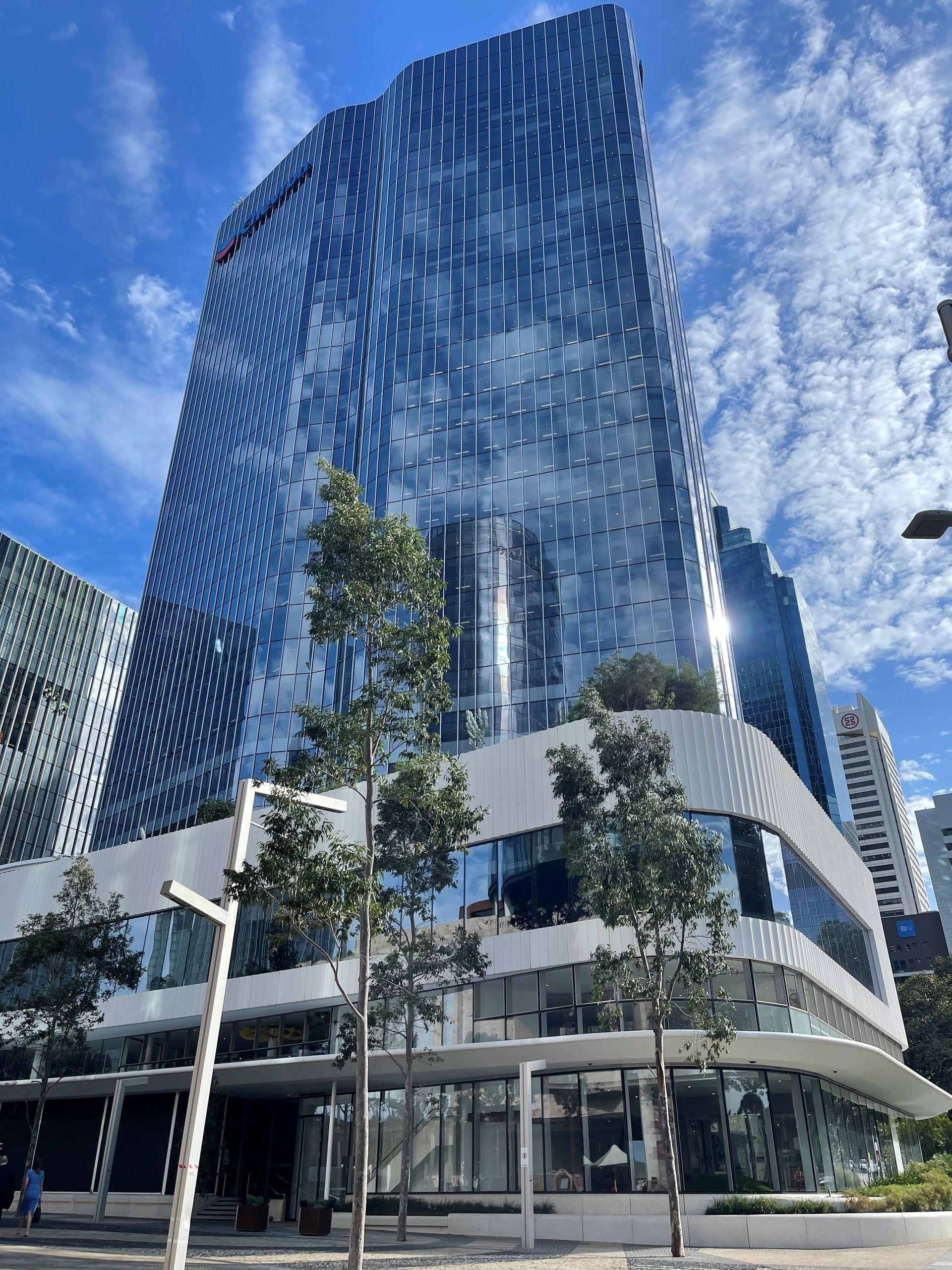 A large building with a lot of windows is lit up at night.