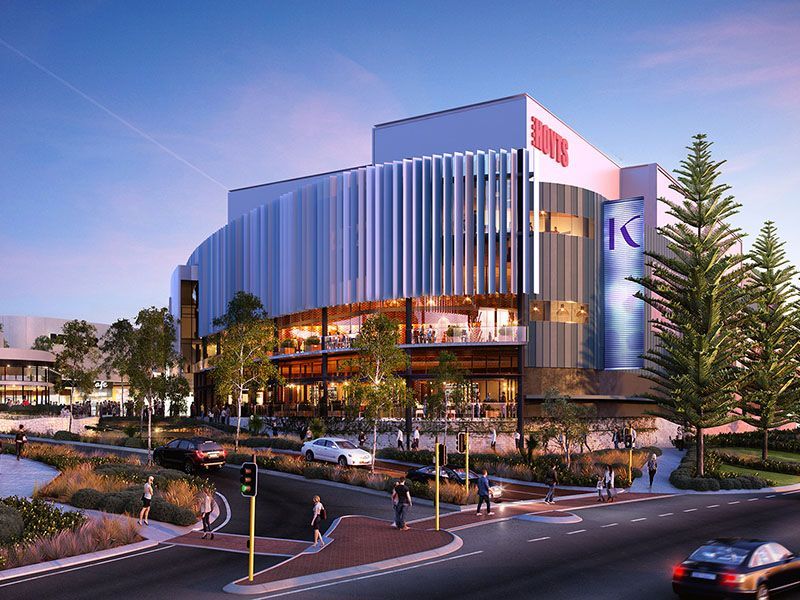 An artist 's impression of a large building with cars parked in front of it.