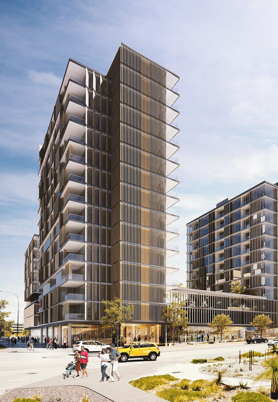 A large building with a lot of windows is lit up at night.