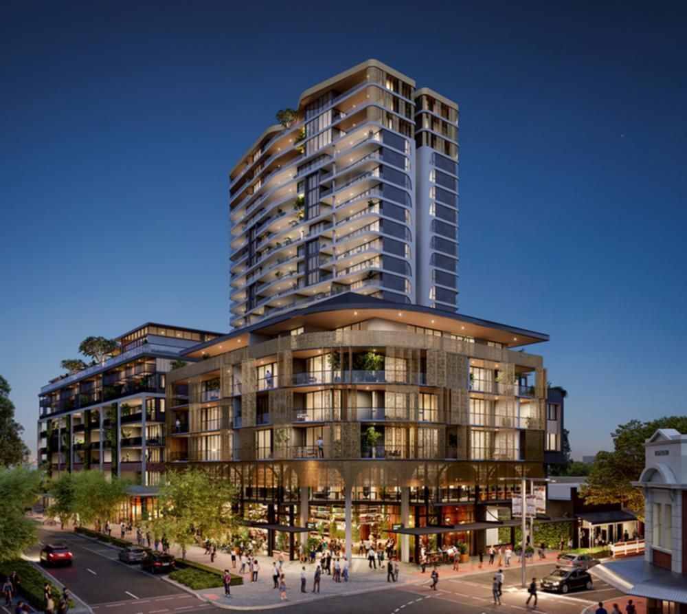 A large building with a lot of windows is lit up at night.