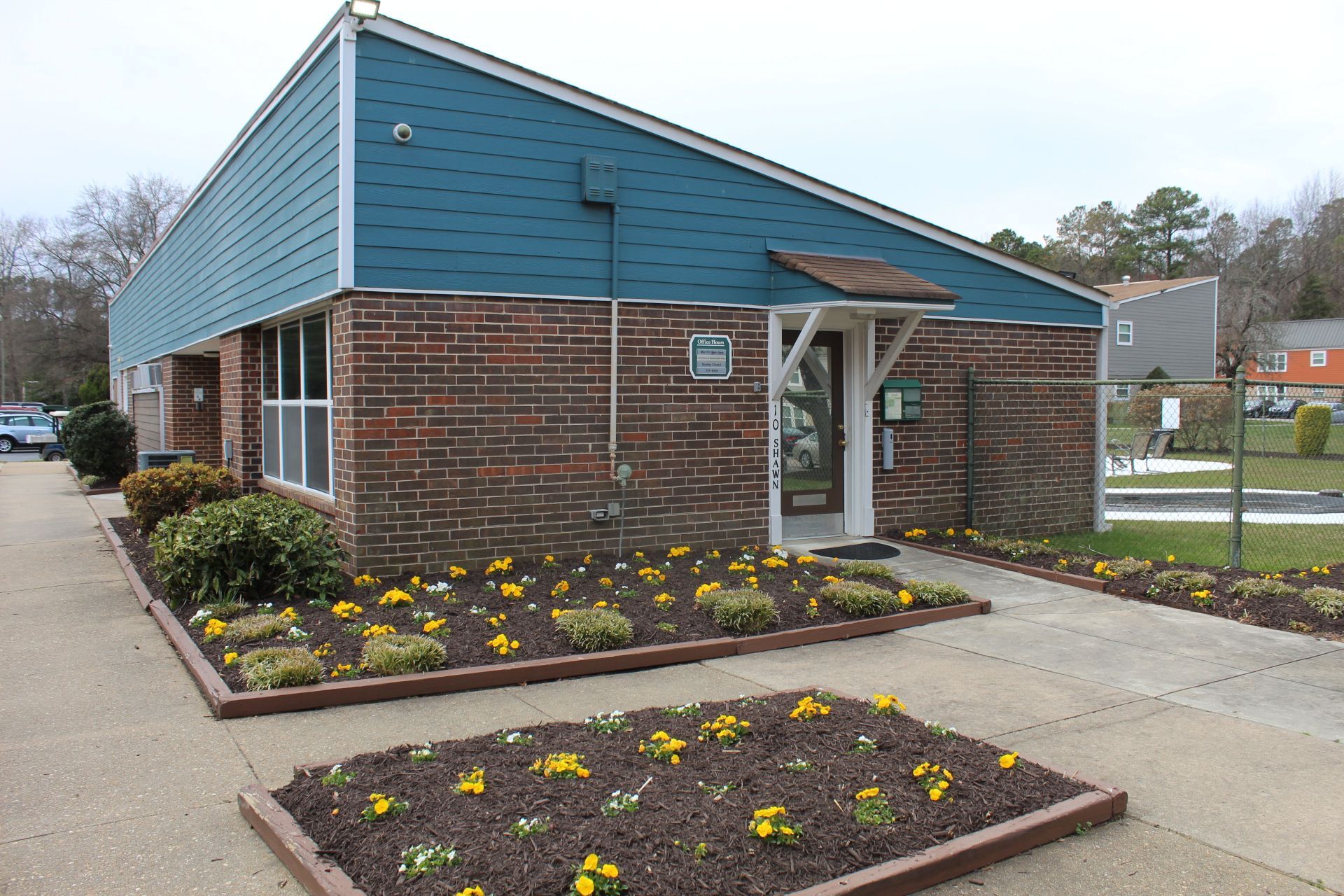 cedarwood manor leasing office building and windows from street