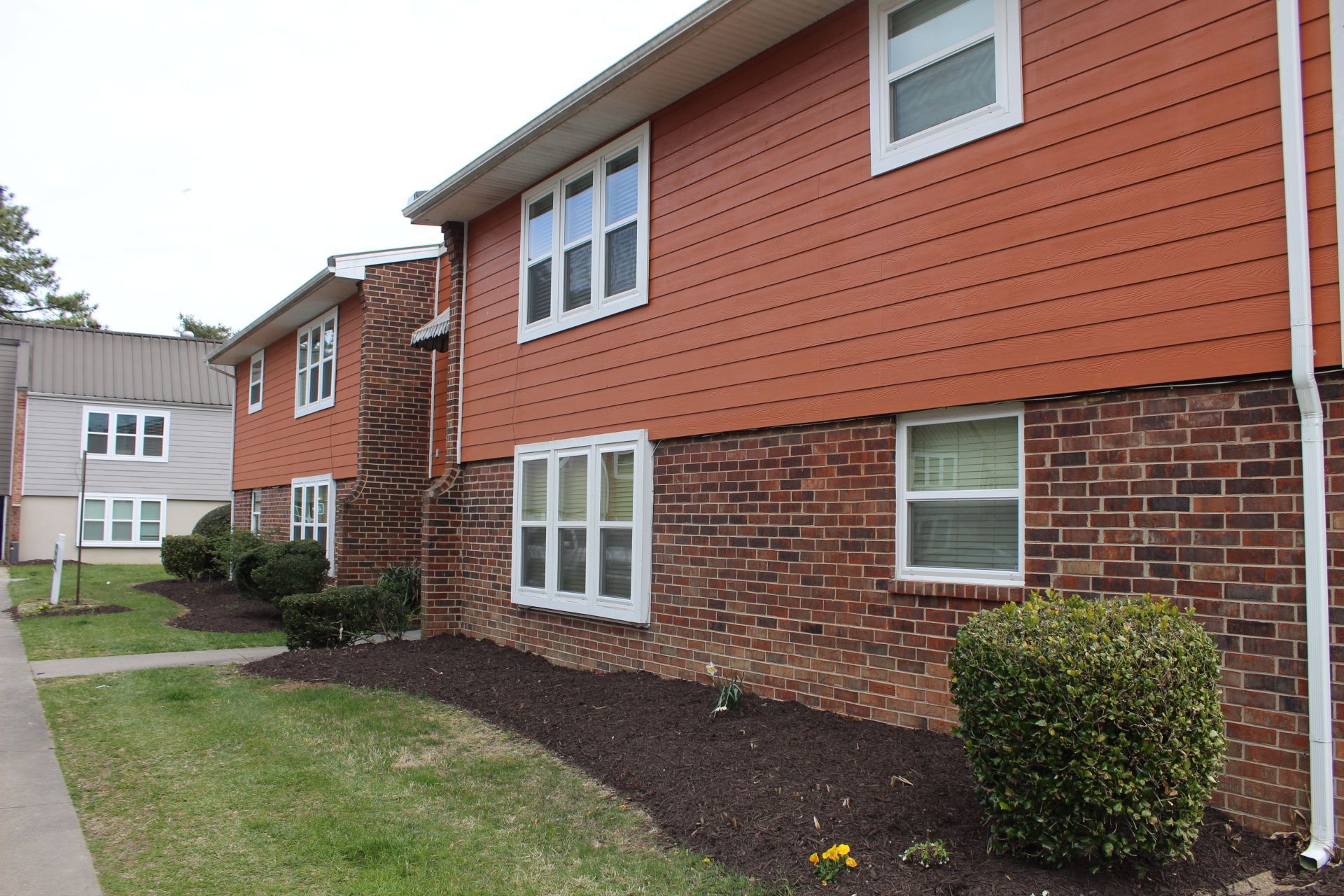 cedarwood manor red building and windows from street
