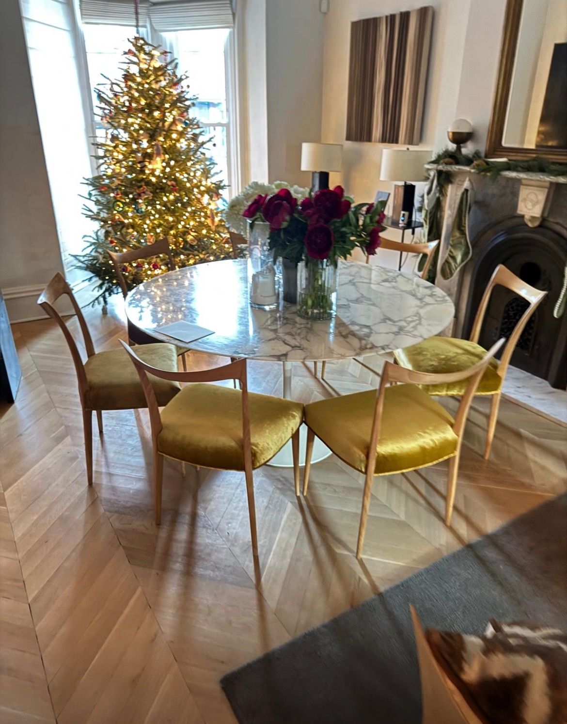 Ornate gold-framed armchair with blue and white patterned fabric back and pillow, blue seat.