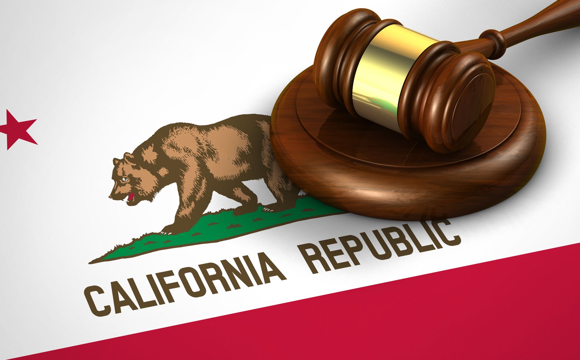 A judge 's gavel sits on top of a california republic flag