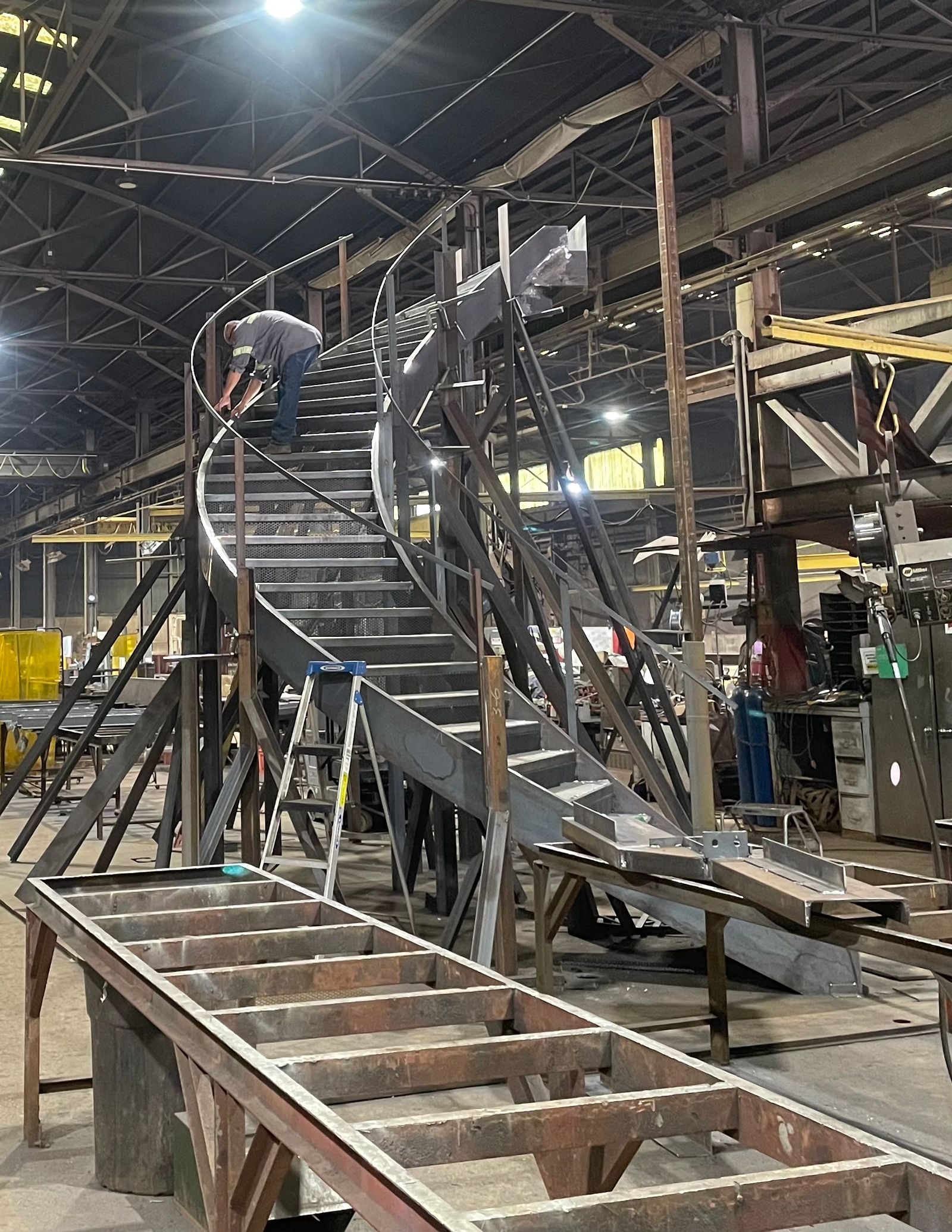 custom steel fabrication curved stairs in the shop before being installed