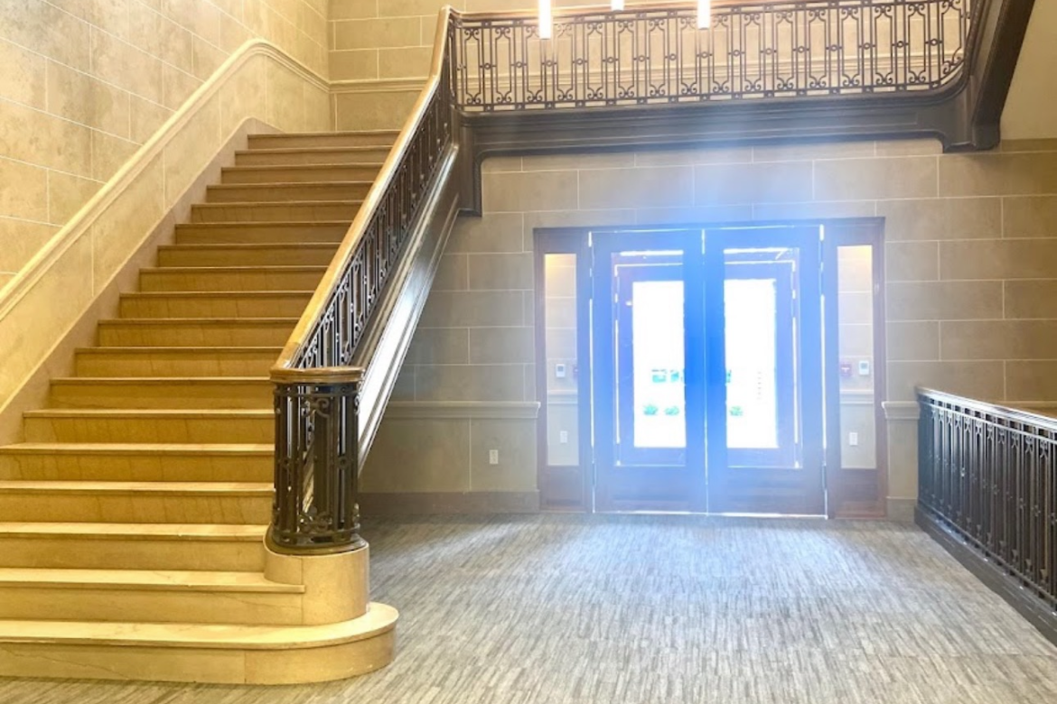 entryway with decorative steel railing
