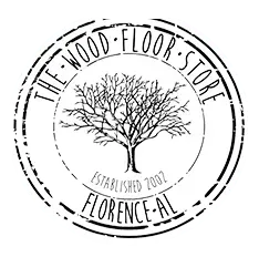 Logo for "The Wood Floor Store" in Florence, AL, featuring a tree silhouette inside a circular, distressed-style stamp.