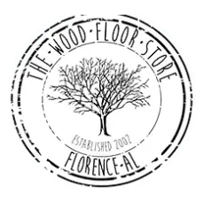Logo for "The Wood Floor Store" in Florence, AL, featuring a tree silhouette inside a circular, distressed-style stamp.