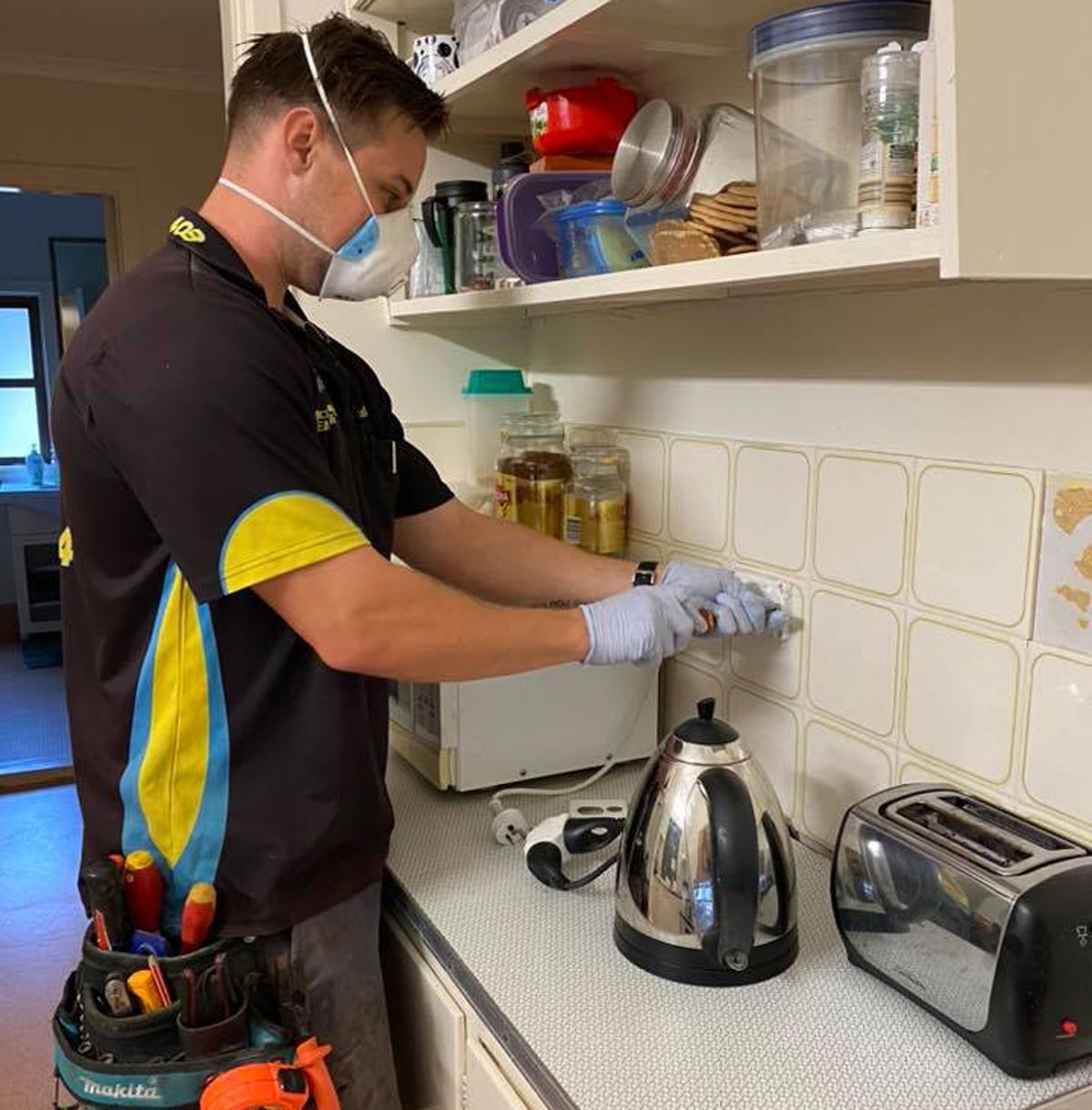 Electrician In Lismore Doing Electrical Work