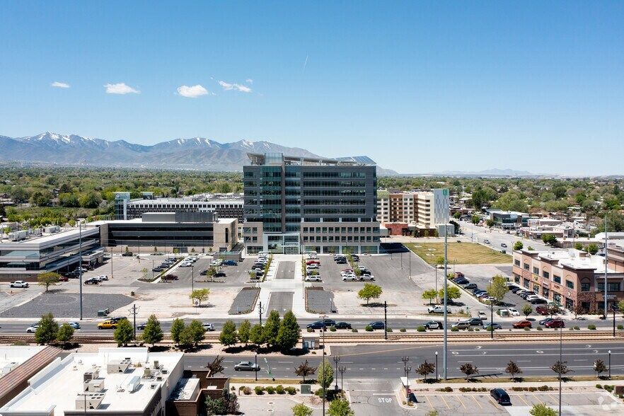 An aerial view of a city with mountains in the background.