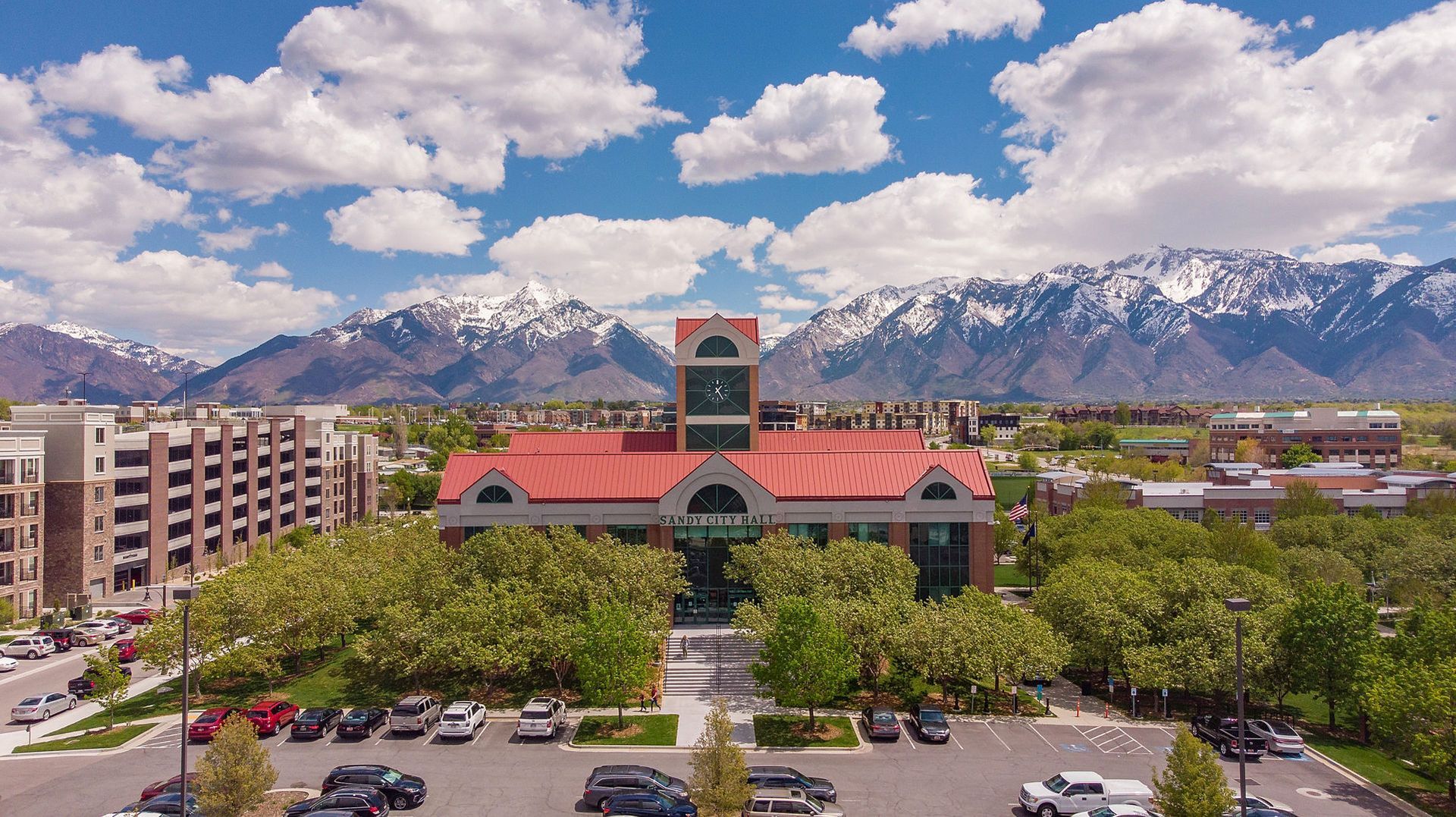 An aerial view of a building with mountains in the background