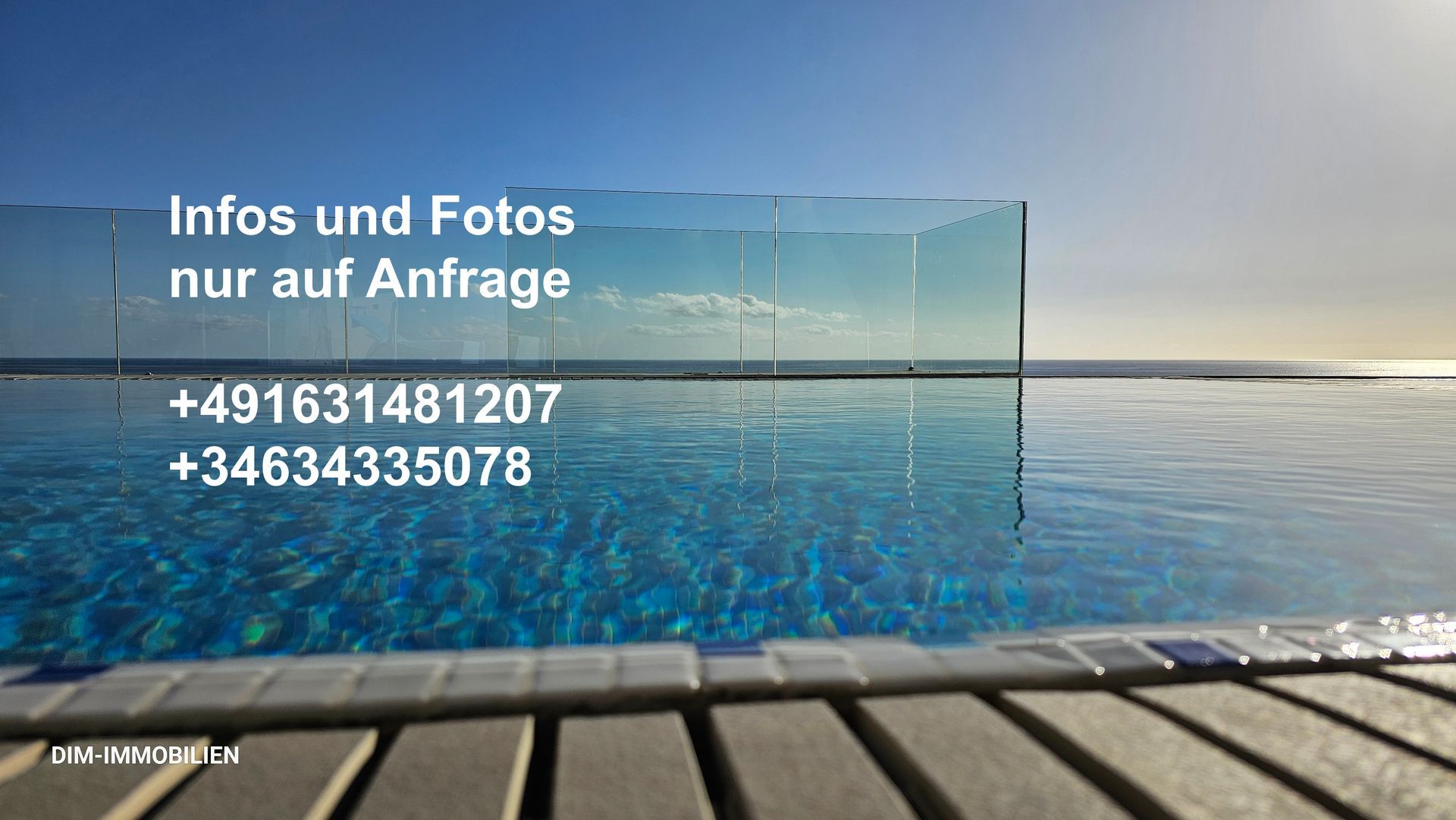 A swimming pool with the words infos und fotos nur auf anfrage above it