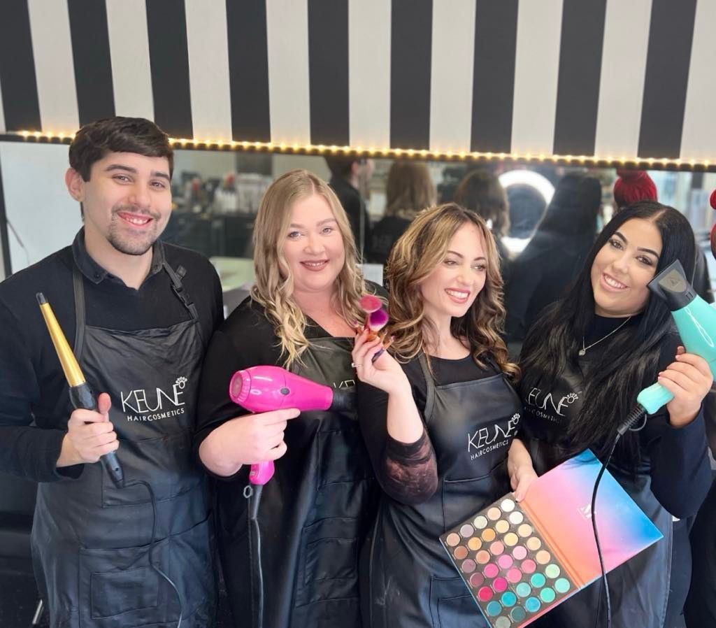 A Group of Hairdressers Are Posing for a Picture in a Salon — Xquisite Styles in Mount Warrigal, NSW