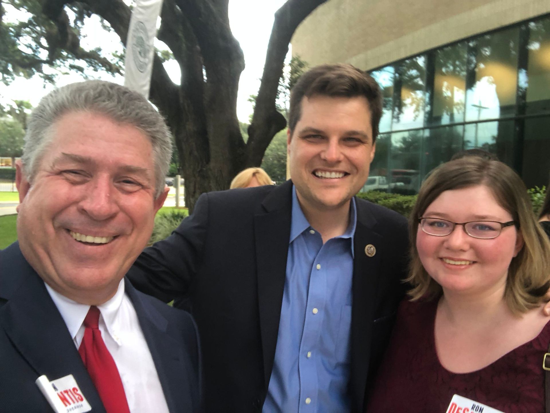 Two men and a woman posing for a picture with one of the men wearing a name tag that says nbc