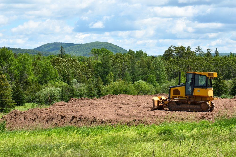 Skid-steer loader levelling the land — Stan Davies Excavations in Maitland, NSW