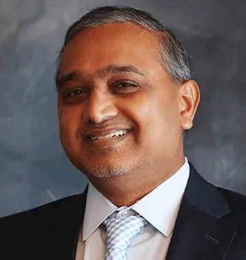 Portrait of Dr. Nanarao Krothapalli, general dentist at Tilton Family Dental.