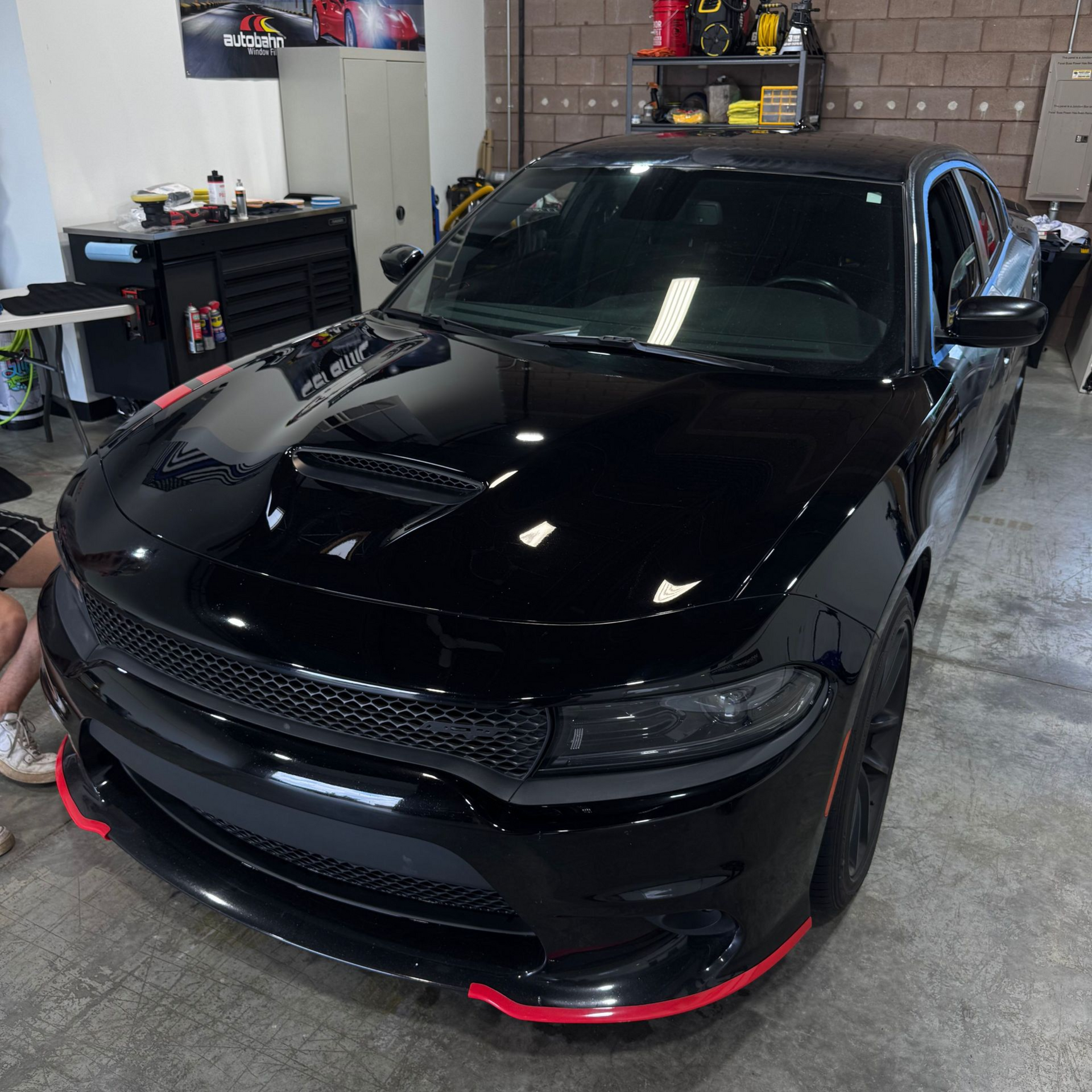 A yellow and white sports car on a black background.