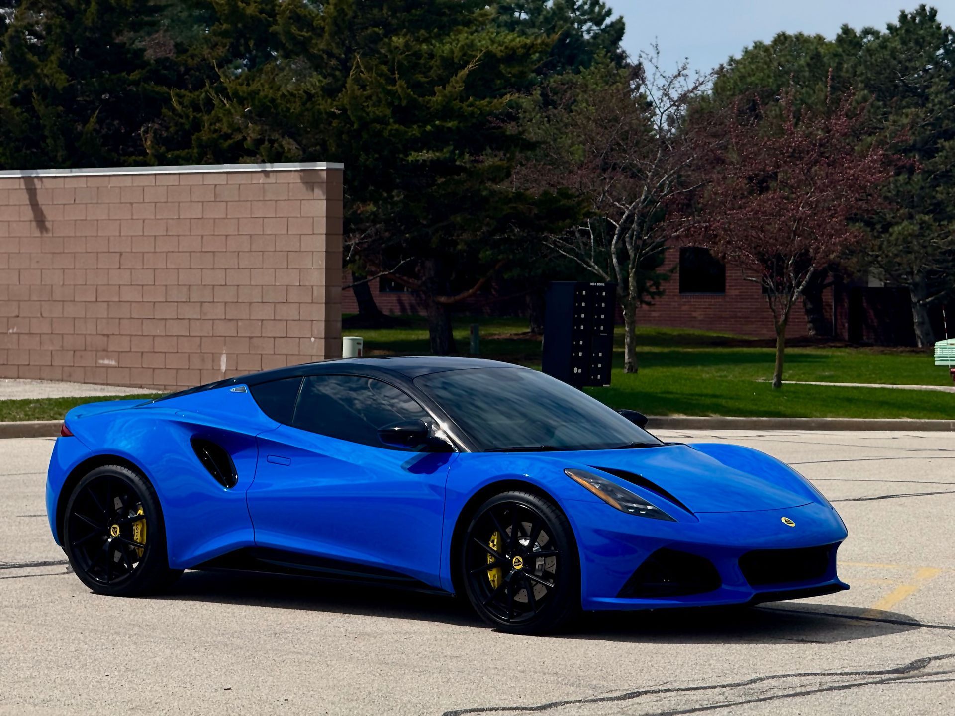 Blue sports car parked outside.