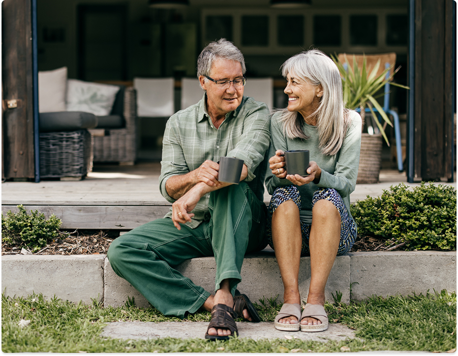 Retired couple enjoying a cup of coffee together.