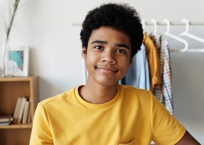 Adolescent in his bedroom