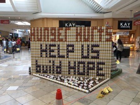 A sign in a mall that says help us build hope