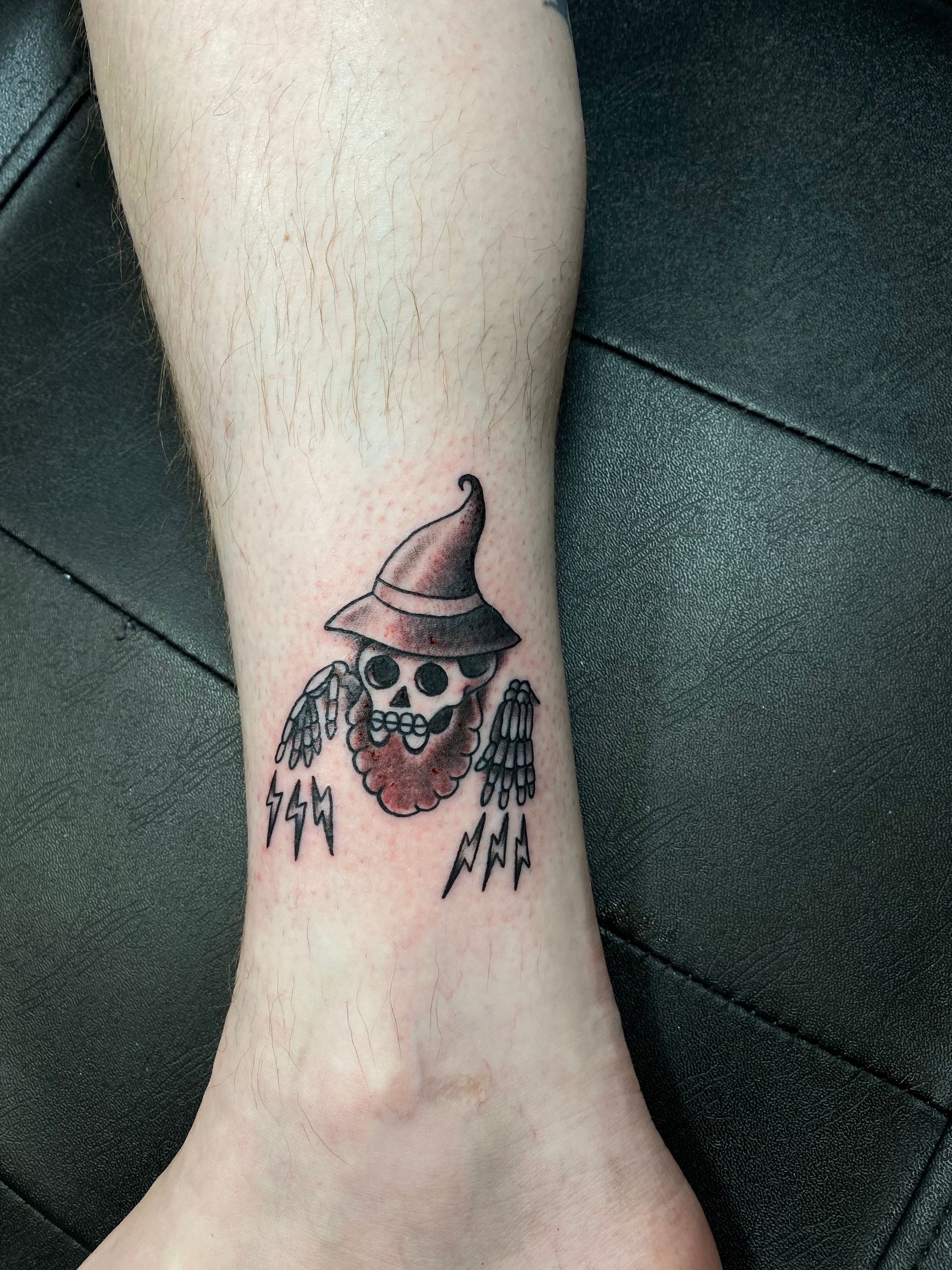 Wizard skull tattoo on forearm done by a tattoo artist in Raleigh. Specializing in custom designs affordable tattoos near me.