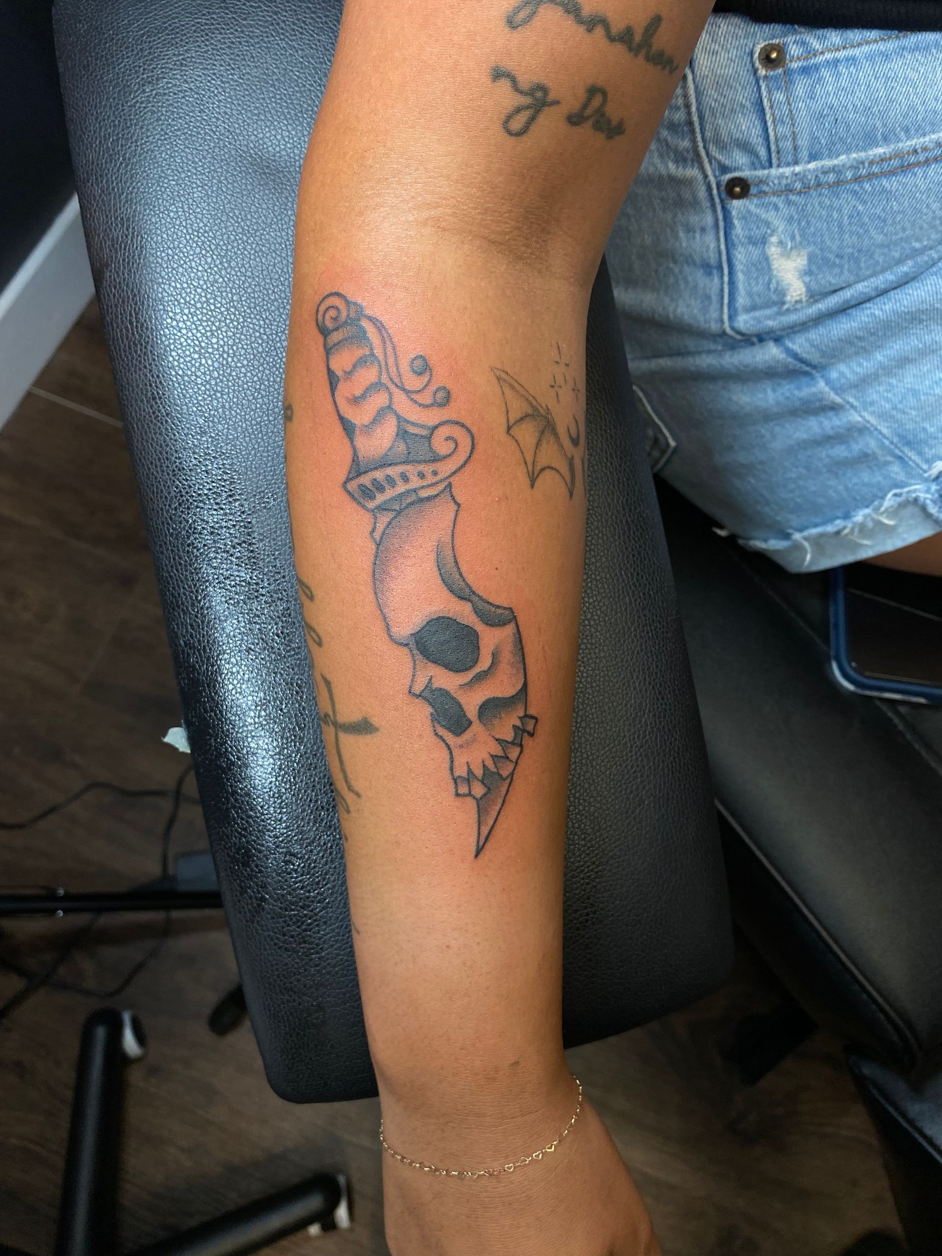 Traditional dagger and skull tattoo from a skilled artist at one of the best tattoo parlors in Raleigh. Walk-ins available.