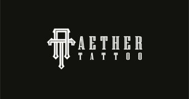 Vanité, Female tattoo artist working on a client, close-up of arm tattoo.