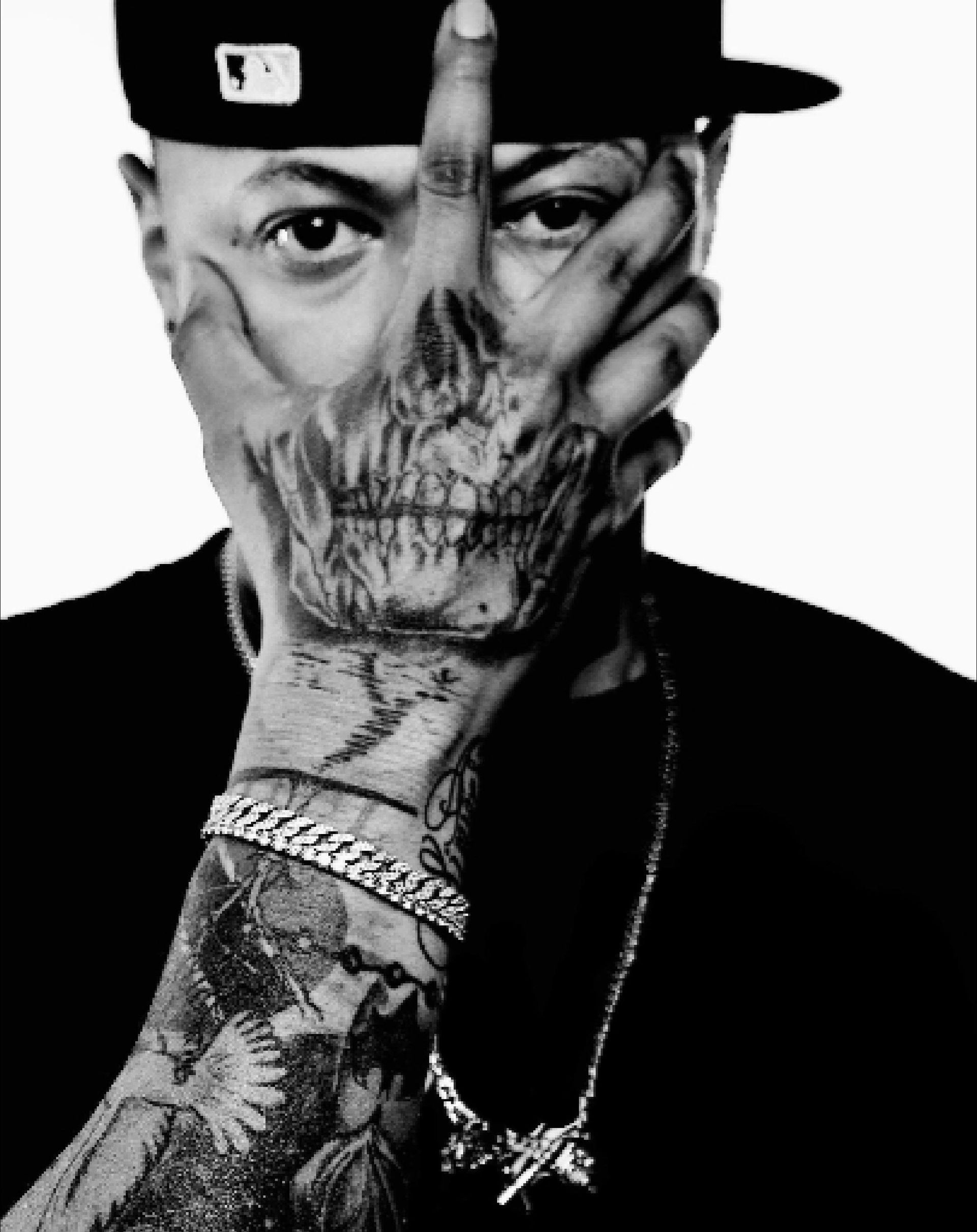 A man with long hair and a beard wearing a red hat