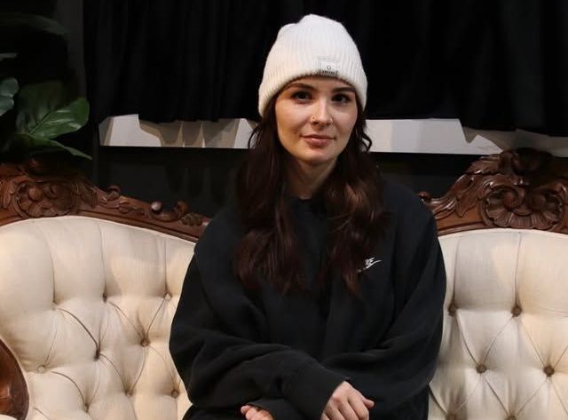 Vanité, Female tattoo artist working on a client, close-up of arm tattoo.