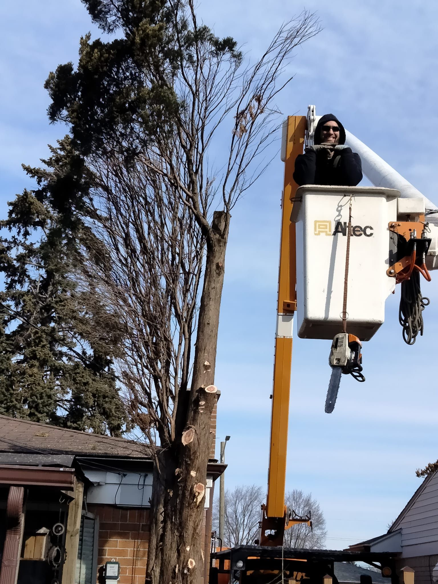 A man is sitting in a bucket that says abc on it